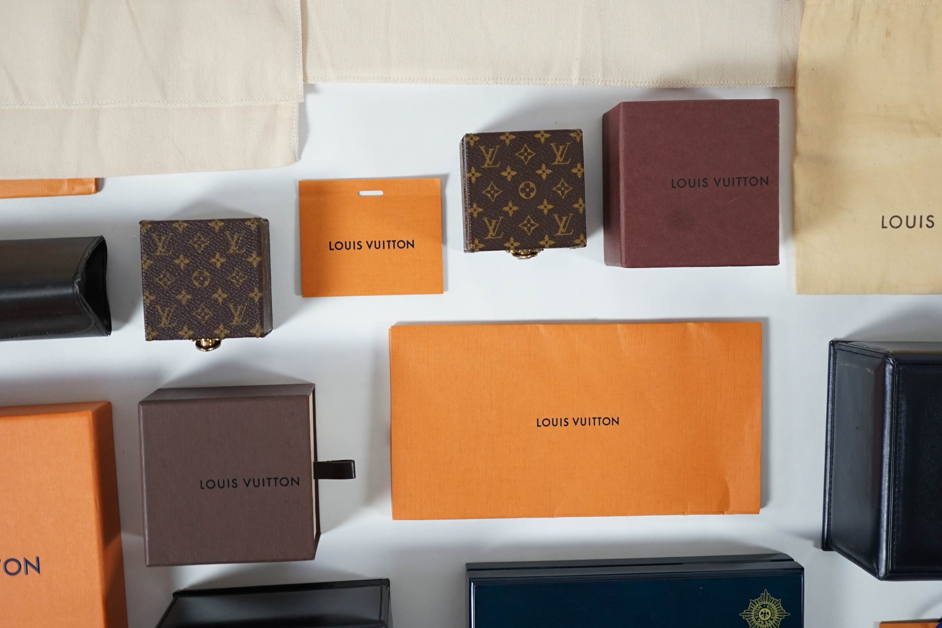 A selection of empty designer boxes including Cartier, Louis Vuitton and Chopard